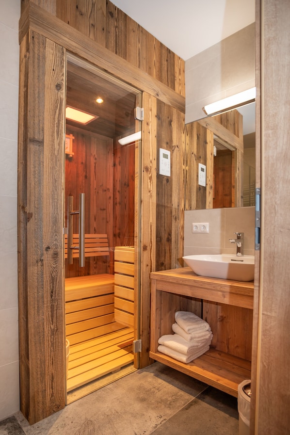 Shower, hair dryer, heated floors, towels