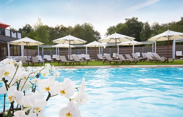 Indoor pool, outdoor pool, open 7:00 AM to 10:00 PM, pool umbrellas