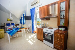 Deluxe Studio (Xenia) | Living area | Flat-screen TV - Xenia Ionis Luxury Concept Apartments (Kefalonia)