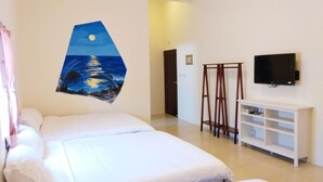 A hotel room with two beds, a painting of a night scene, a TV on the wall, and a white console table. - Rainbow Homestay (Lyudao)