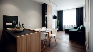 Standard Apartment | Living area | Flat-screen TV - Austrian Apart Hotel (Lviv)