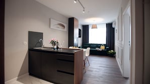 Standard Apartment | Living area | Flat-screen TV - Austrian Apart Hotel (Lviv)