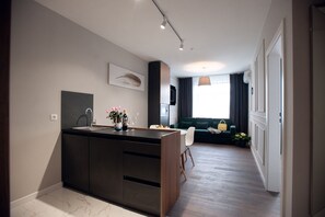 Standard-Apartment | Wohnbereich | Flachbildfernseher