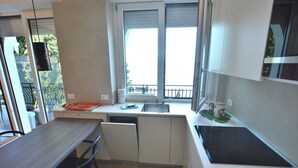 Apartment, 1 Bedroom | Private kitchen | Espresso maker, coffee/tea maker, full-sized fridge, microwave - Leonardo Walsh Apartment With Lake View (Torri del Benaco)
