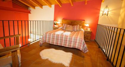 La Fragua is a beautiful little house with a gable roof built in stone and wood