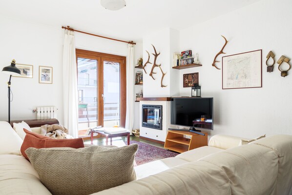 Apartment, 2 Bedrooms | Living area | Flat-screen TV, fireplace