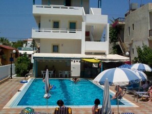 Outdoor pool, pool umbrellas, pool loungers