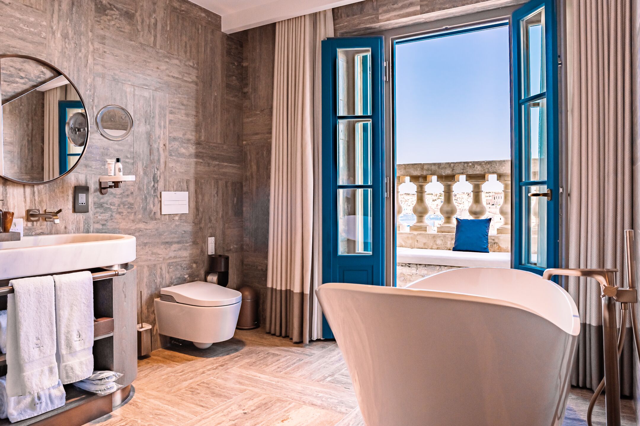 grand harbour penthouse suite | bathroom | designer toiletries, hair dryer, bathrobes, slippers