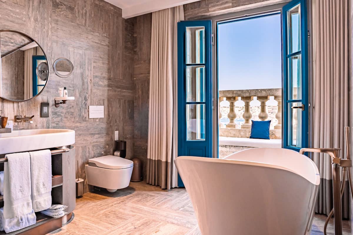 grand harbour penthouse suite | bathroom | designer toiletries, hair dryer, bathrobes, slippers