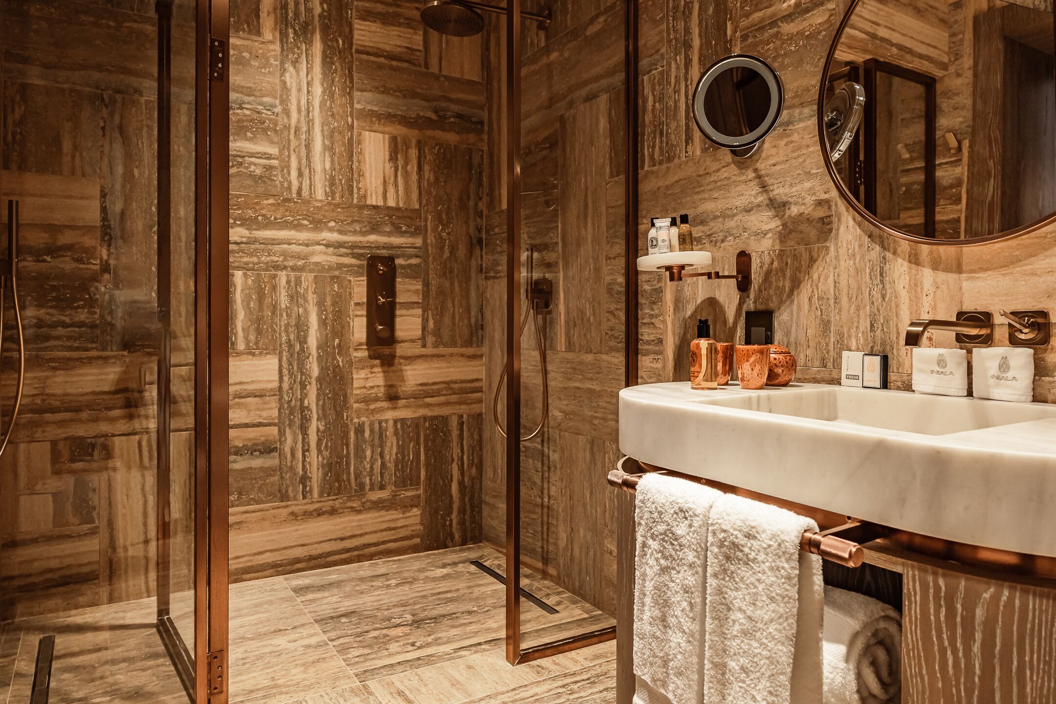 deluxe junior city suite | bathroom | designer toiletries, hair dryer, bathrobes, slippers