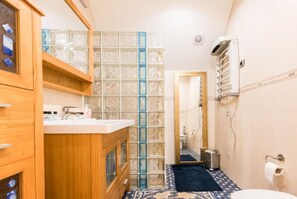 Shower, hair dryer, towels, soap