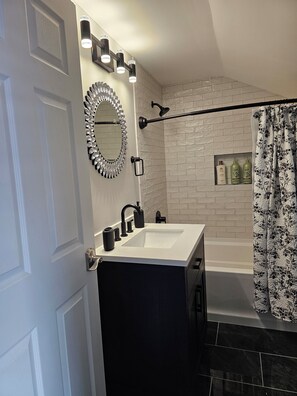 Combined shower/tub, hair dryer, towels, soap