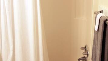 Bathtub, hair dryer, towels
