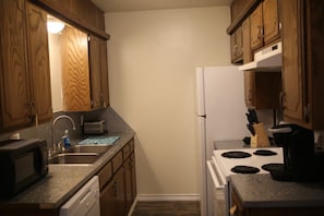 Microwave, oven, coffee/tea maker, cookware/dishes/utensils