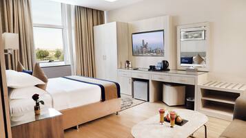 Habitación Deluxe | Caja de seguridad en la habitación y tabla de planchar con plancha