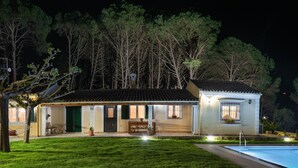 A two-story house with a swimming pool, a covered patio, and a well-maintained lawn. -  Villa Pine Forest  (Corfu)