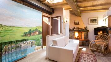 Family Triple Room, 2 Bedrooms, Garden View | Living area | 42-inch flat-screen TV with satellite channels, TV, fireplace