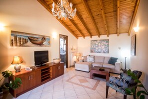 Apartment, 1 Bedroom | Living room | Flat-screen TV