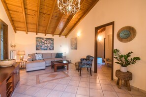 Apartment, 1 Bedroom | Living room | Flat-screen TV