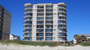 A multi-story hotel with balconies, located near a beach. - Updated!!! Crescent Towers II 708,  2 BR Ocean Front Luxury Condo with Pool (North Myrtle Beach)