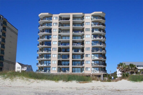A multi-story hotel with balconies, located near a beach. - Updated!!! Crescent Towers II 708,  2 BR Ocean Front Luxury Condo with Pool (North Myrtle Beach)