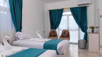 Garden Suite | 1 bedroom, minibar, individually decorated, individually furnished