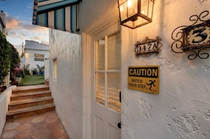 A house entrance with a caution sign, a mailbox, and a number 347A sign. - Blocks from the beach, enjoy this newly renovated studio. (Hermosa Beach)