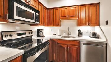 Condo, 1 Bedroom | Private kitchen | Fridge, microwave, stovetop, dishwasher