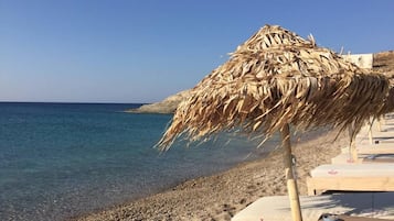 On the beach, sun loungers, beach towels