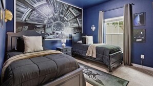 A bedroom with two beds, a large wall mural, a window with curtains, and a ceiling fan. - 5 BD/ 4 BA/ Paradise Palms (3073 BP) (Kissimmee)