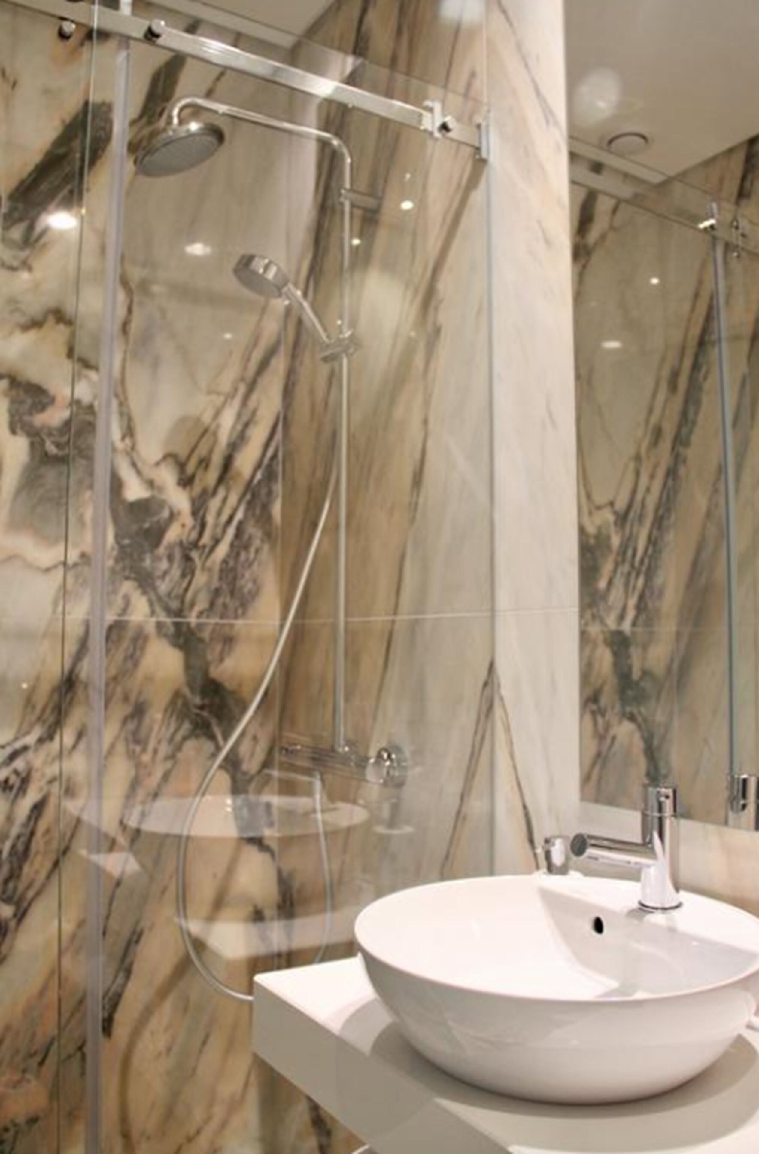 deluxe room (201) | bathroom | shower, bidet, towels, soap