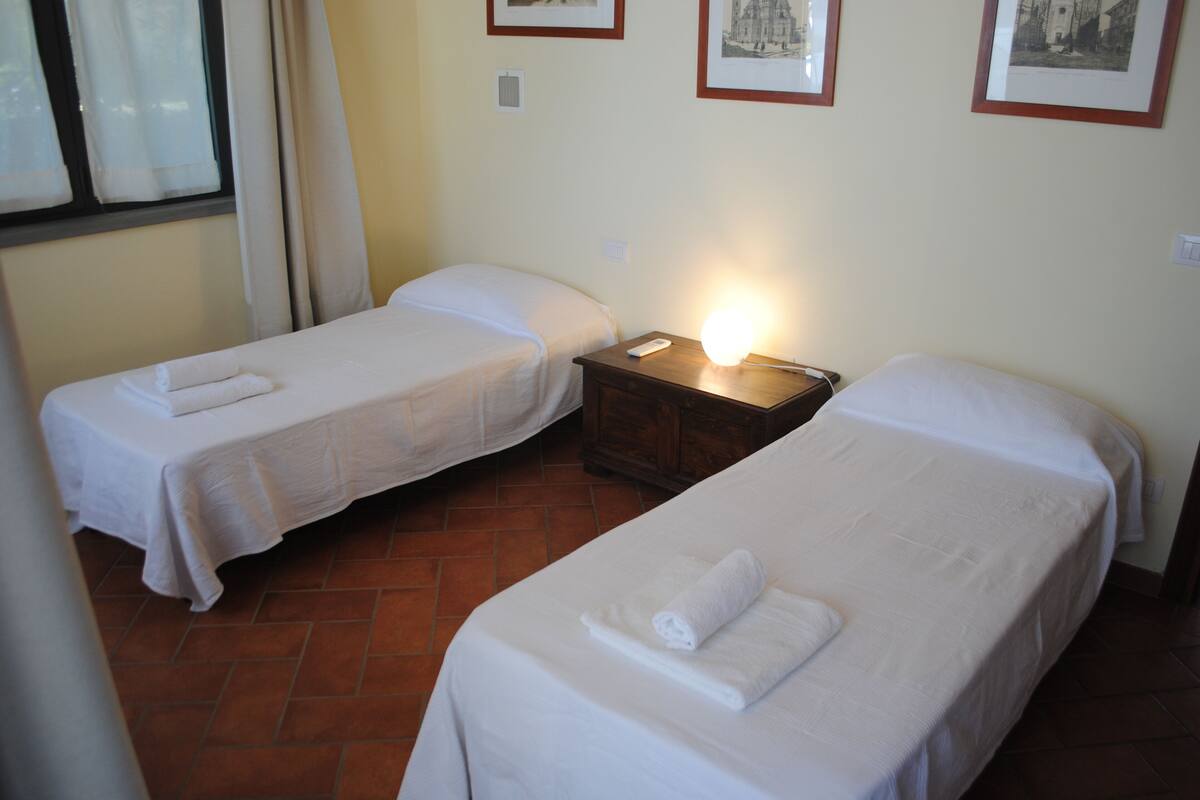 Hypo-allergenic bedding, desk, laptop workspace, blackout curtains