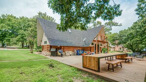 A log cabin with a deck, outdoor seating, and a grill area. - 6Bdrm Cabin Walk to Beach Pool-Table Firepit! (Kingston)