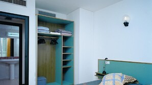 A bedroom with a bed, a wardrobe, a bedside table, and a nightstand. - Apartments very close to the beach. Ref.LLORET SUN-24 (Lloret de Mar)