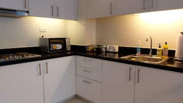 Condo, 2 Bedrooms | Private kitchen | Fridge, microwave, stovetop, electric kettle