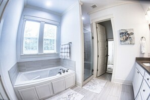 Bathtub, jetted tub, hair dryer, towels