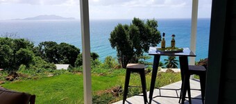 Lovely house and green setting, splendid view of the sea and islands of Les Saintes.