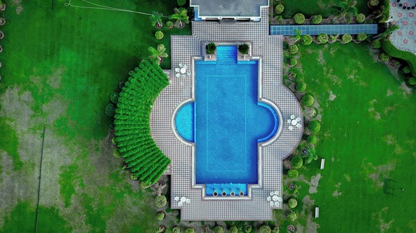 Outdoor pool, open 7:00 AM to 9:00 PM, pool loungers - Umaid Farm Resort - A Legacy Vintage Stay in Jaipur (Jalsu)