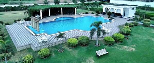 Outdoor pool, open 7:00 AM to 9:00 PM, pool loungers