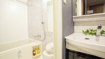 Separate tub and shower, free toiletries, hair dryer, slippers