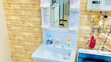 Apartment, 1 Bedroom | Bathroom | Shower, free toiletries, hair dryer, slippers