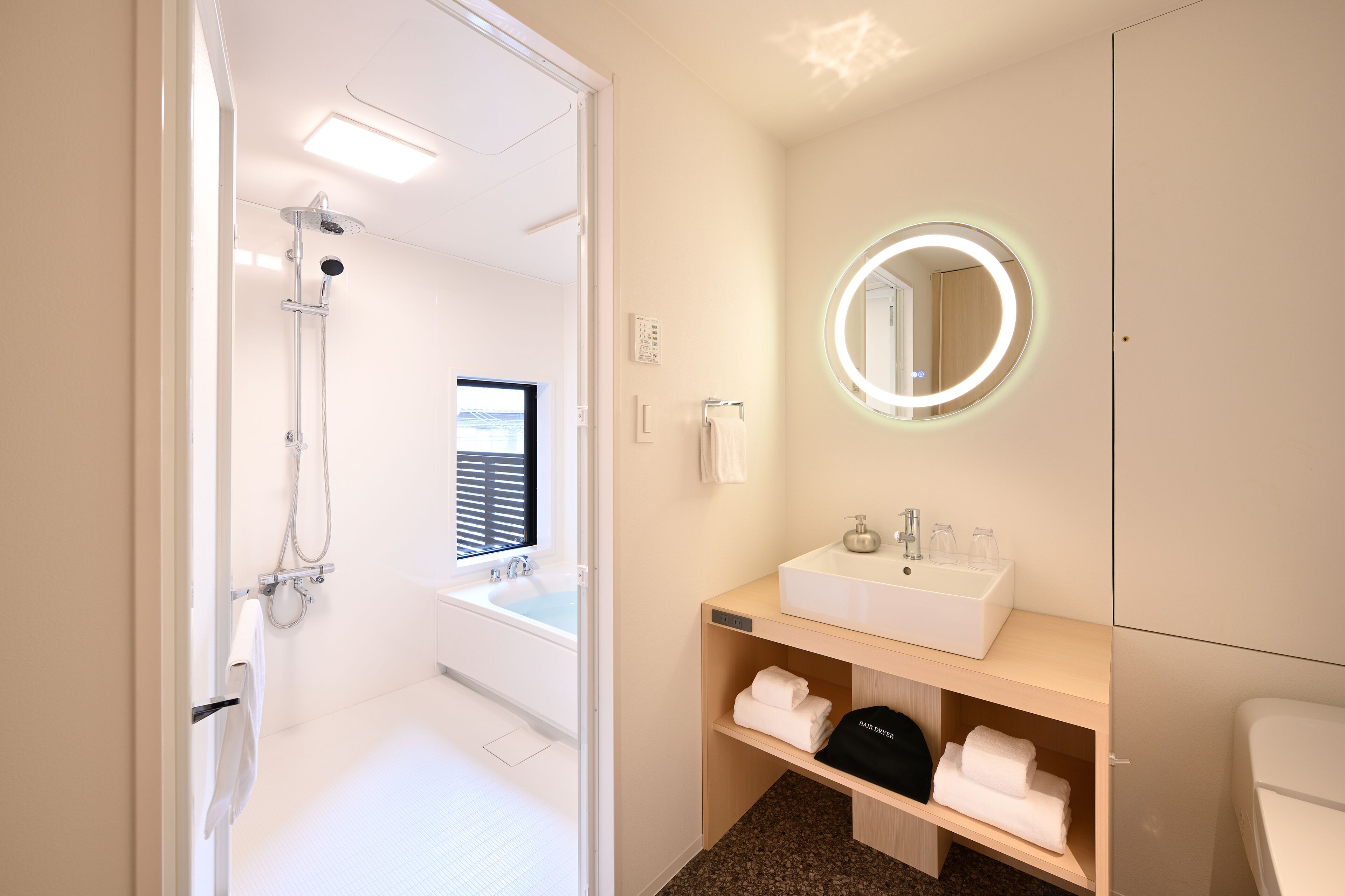 deluxe king with bathtub | bathroom | free toiletries, hair dryer, bathrobes, slippers