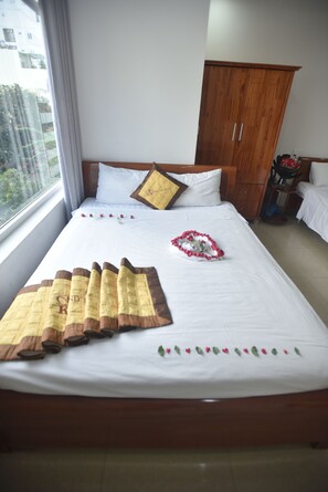 Habitació quàdruple Deluxe | Minibar i wifi gratuïta 