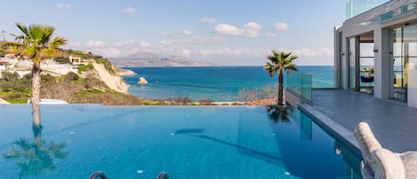 Seasonal outdoor pool, open 10:00 AM to 6:00 PM, pool umbrellas