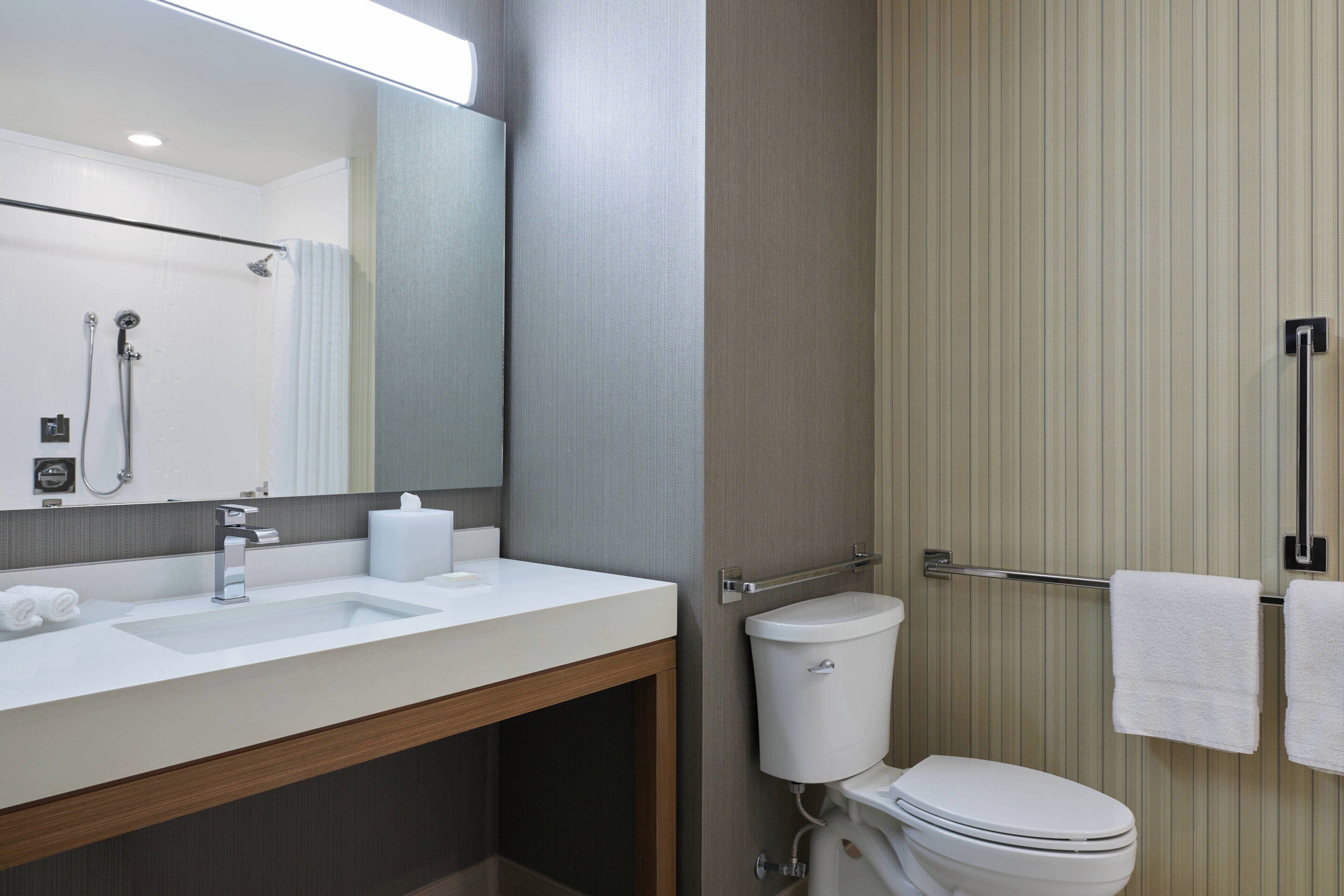 rainfall showerhead, designer toiletries, hair dryer, towels