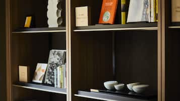 A bookshelf with books and decorative items.