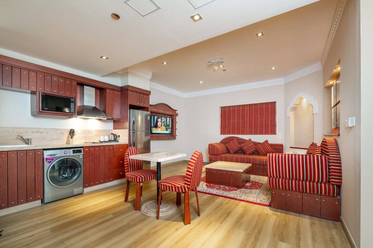 A compact living space with a kitchen, dining area, and seating area.