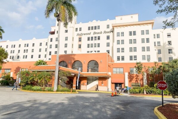 A hotel with a prominent "Hollywood Beach Resort" sign, featuring a modern architectural style with a flat roof and multiple windows. - 626 Ocean View Hollywood Studio (Hollywood)