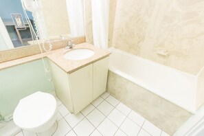 A bathroom with a sink, toilet, and bathtub. - 608 Studio Apt Hollywood Beach (Hollywood)