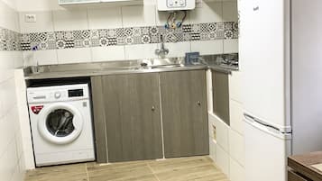 Fridge, microwave, stovetop, dining tables